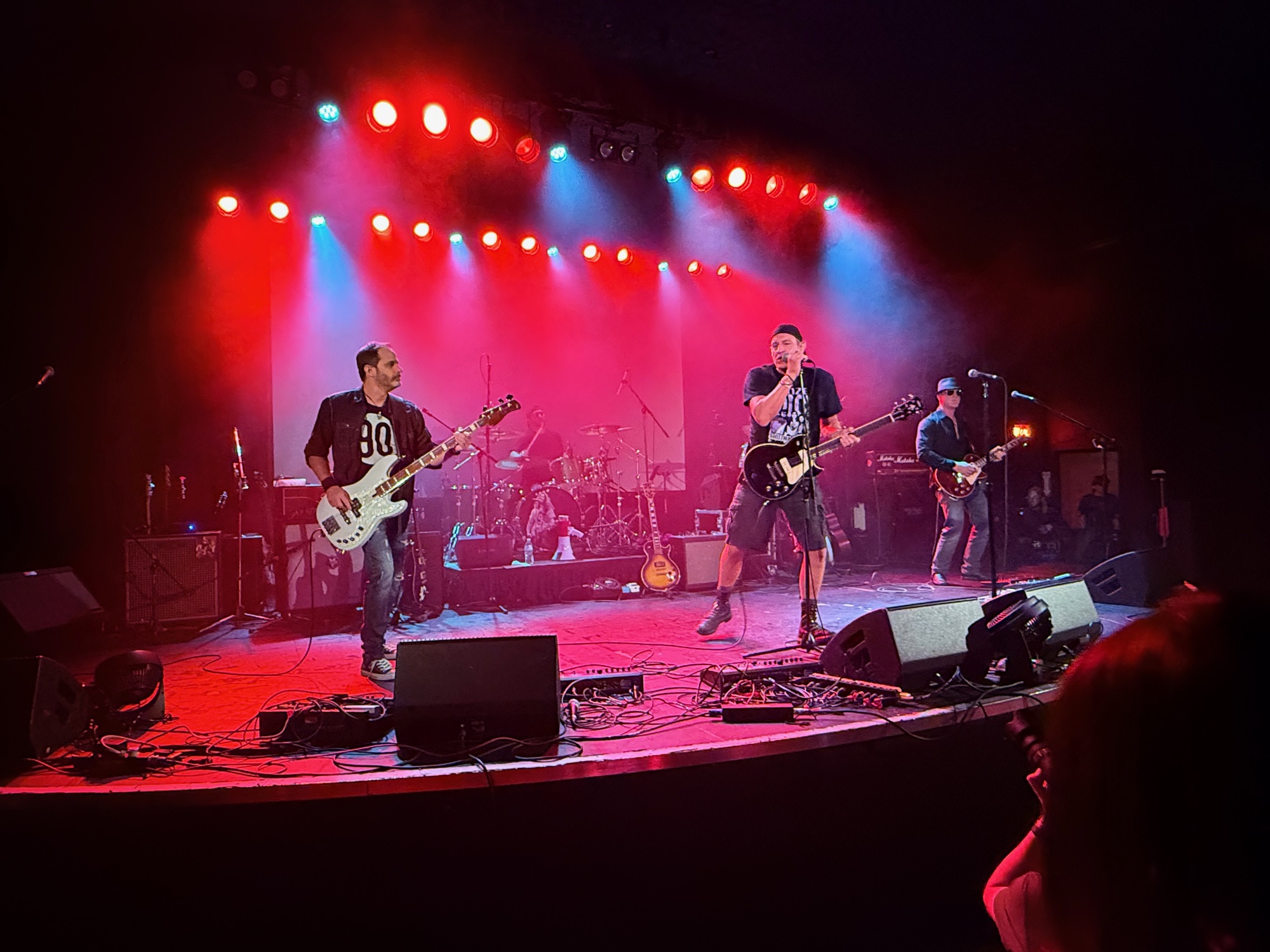 Secondhand Flannel on stage under red and blue lights